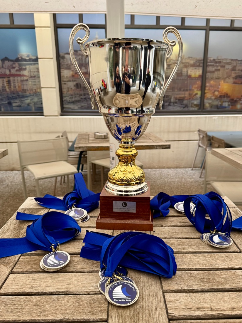 The EUMETSAT Sailing Cup trophy surrounded by participant medals